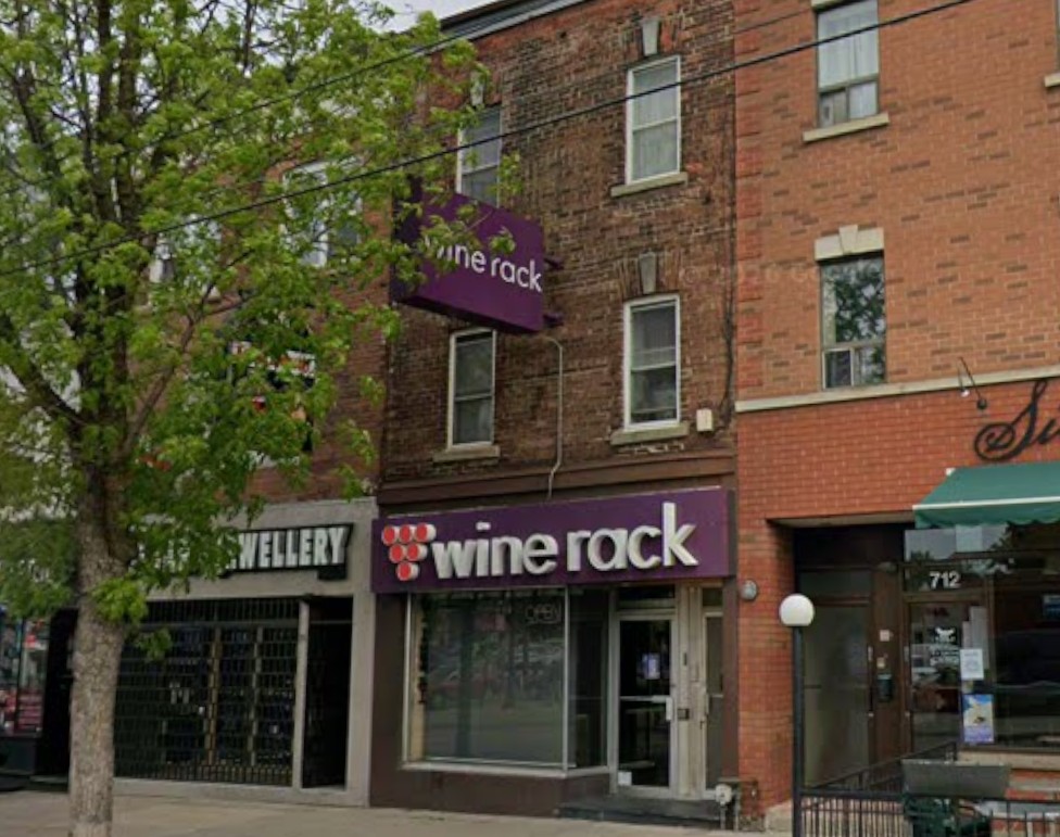 Three-storey brick building at 714 College Street, Toronto